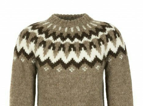 Hand-knitted brown oversized unisex Scandinavian Lopapeysa sweater with a chunky-knit white and dark brown Nordic round yoke, featuring a double crew neck, ribbed cuffs, and hem, made from soft hypoallergenic baby alpaca and merino wool.