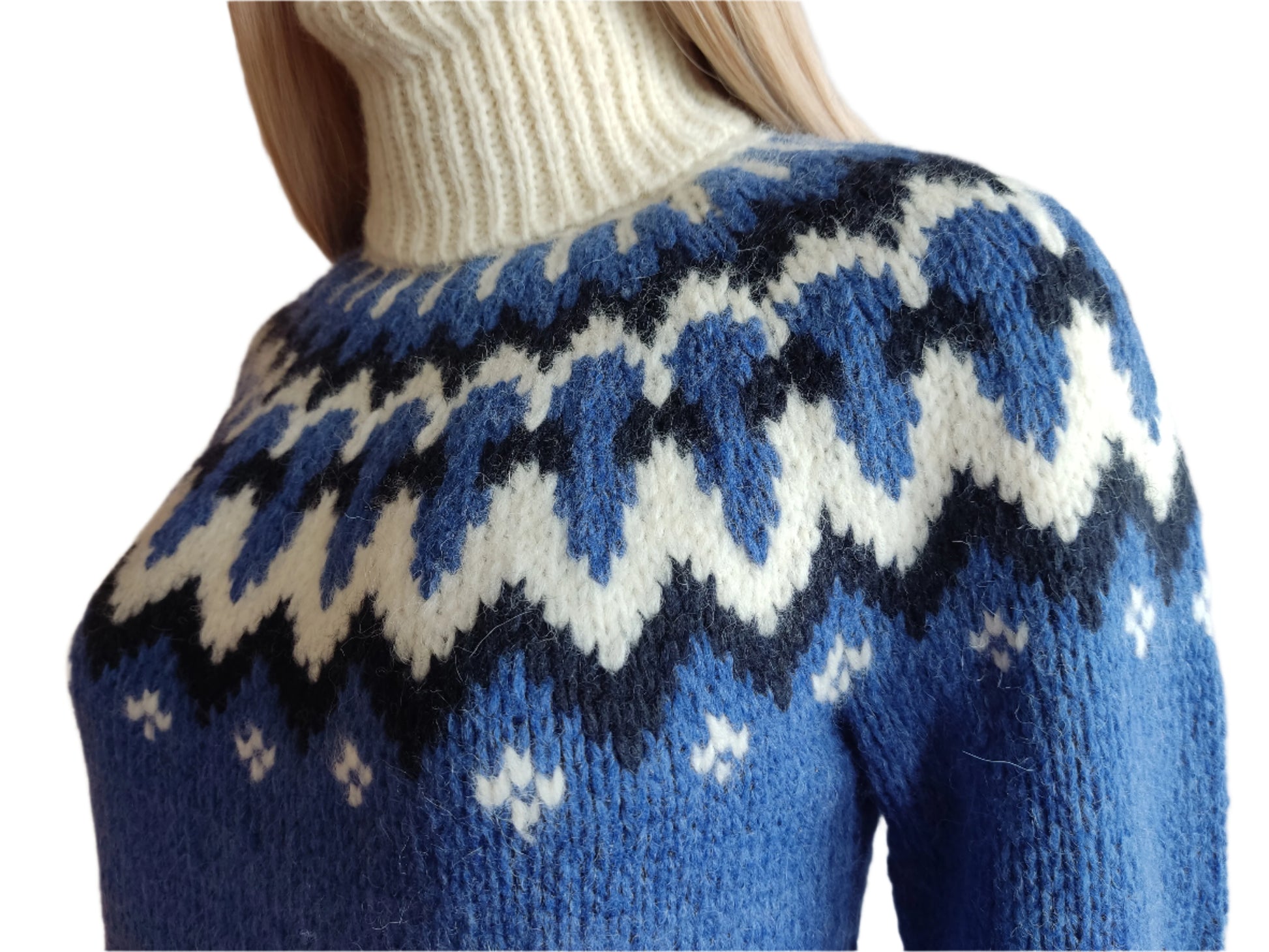 Hand-knitted blue oversized unisex Scandinavian Lopapeysa sweater with a chunky-knit white and navy Nordic round yoke, featuring a double crew neck, white ribbed cuffs, and hem, made from soft hypoallergenic baby alpaca and merino wool.