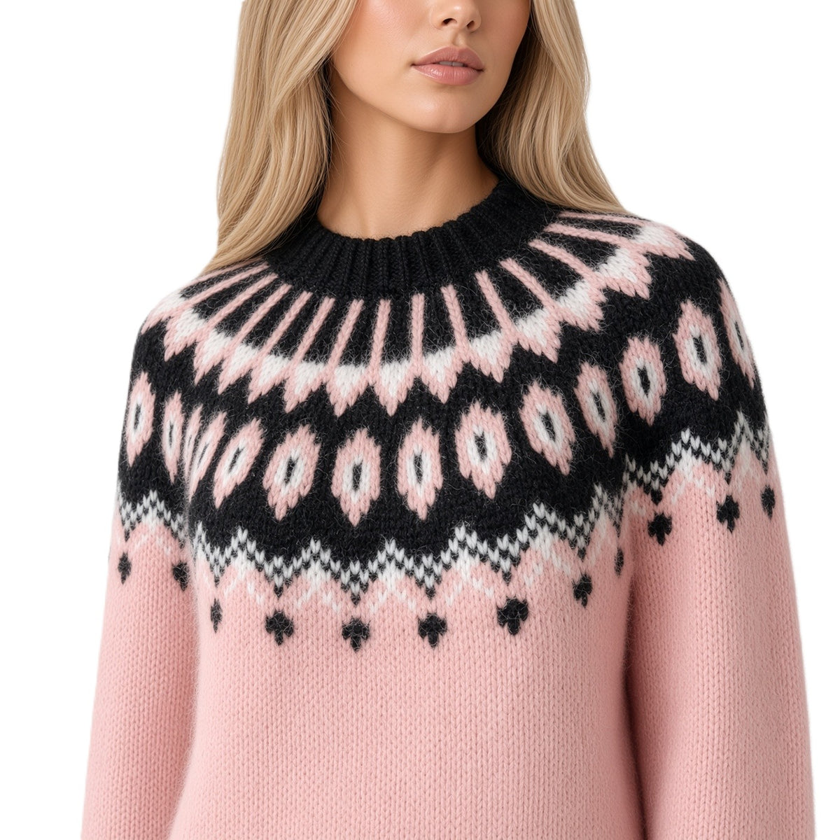 A close-up of a woman wearing a pink knit sweater with a black and white Fair Isle yoke pattern, set against a plain white background.