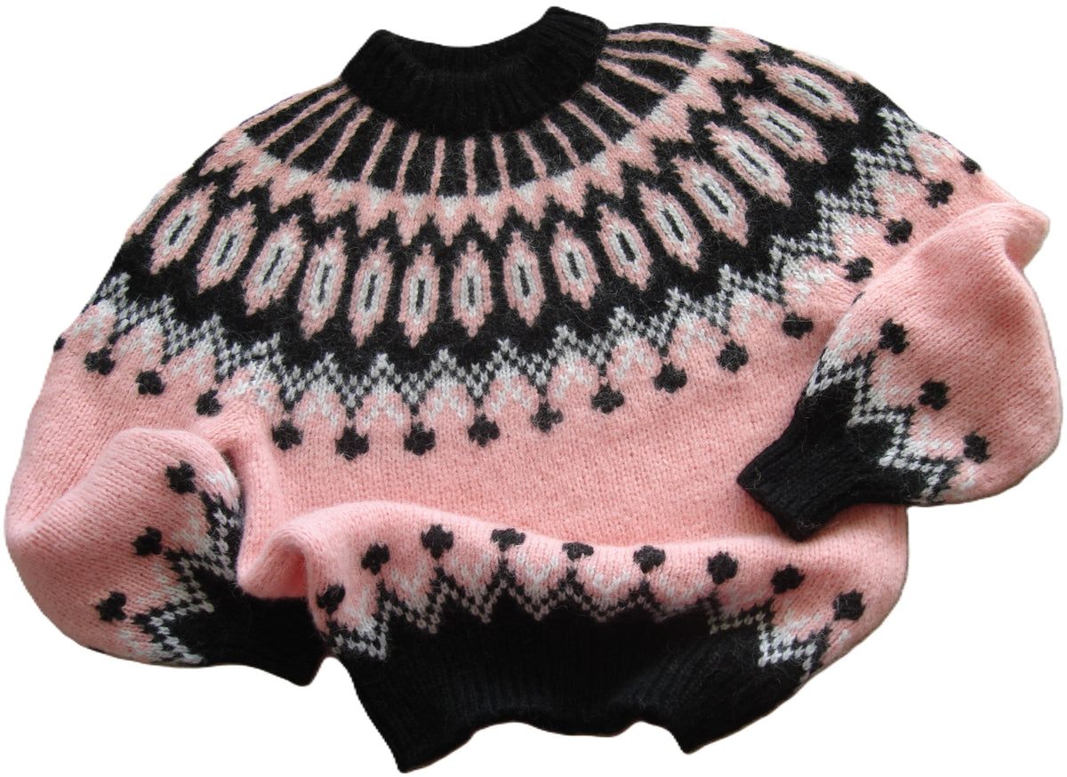 A pink knit sweater with a black and white Fair Isle pattern, featuring a mock neck, balloon sleeves, and ribbed cuffs and hem, shown on a plain white background.