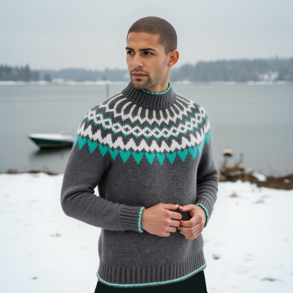 Hand-knitted gray unisex Scandinavian Lopapeysa sweater with a thick-knit white and teal green Nordic round yoke, featuring a double mock collar, cuffs, and hem with a two-tone white-teal knitted cord, made from soft hypoallergenic baby alpaca and merino wool.
