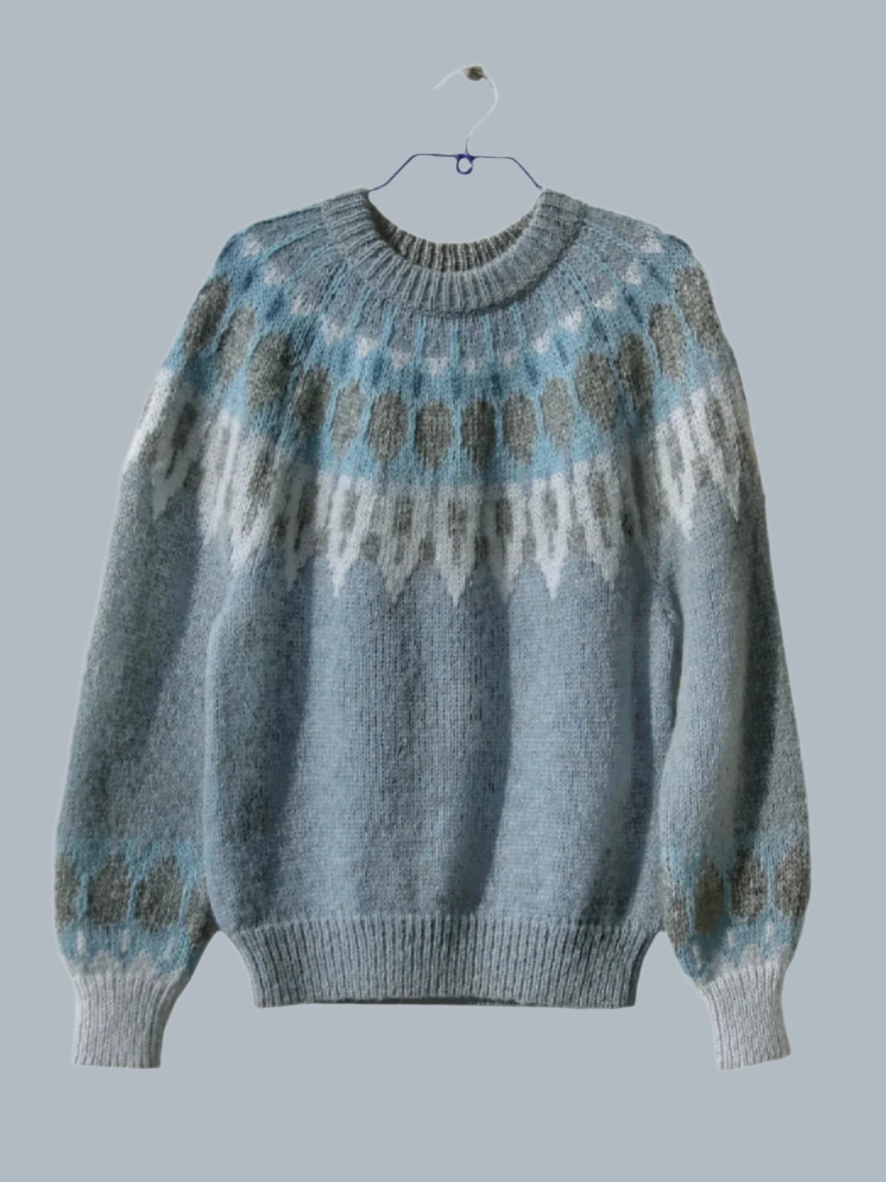 Hand-knitted women’s Scandinavian Lopapeysa sweater in Denim, featuring a harmonizing Gray & Blue Nordic round yoke, with ribbed hem, cuffs, and double crew collar in denim, made from soft hypoallergenic baby alpaca and merino wool.