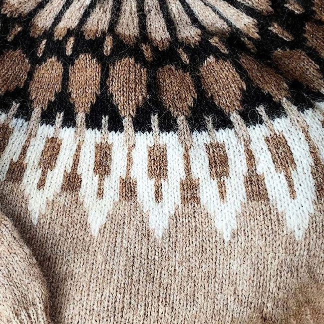 Hand-knitted women’s Scandinavian Lopapeysa sweater in brown tan, featuring a harmonizing White & Black Nordic round yoke, with ribbed hem, cuffs, and double crew collar in brown, made from soft hypoallergenic baby alpaca and merino wool.