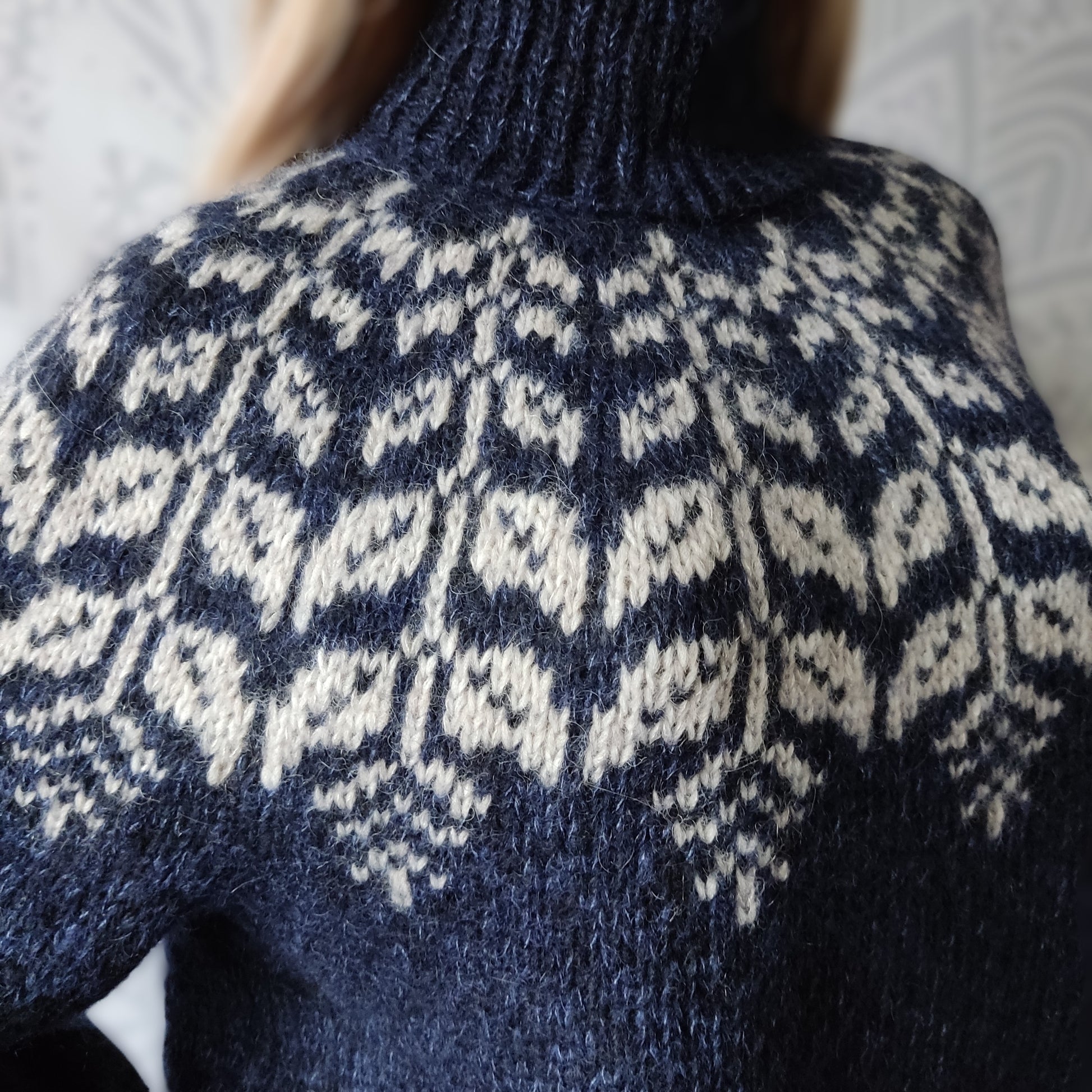 Close-up of a blue and white patterned sweater