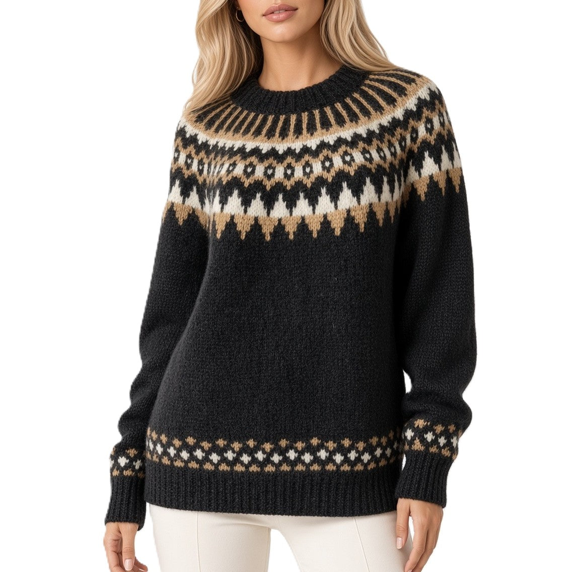 A woman wearing a black knit sweater with a beige and cream Fair Isle pattern across the yoke, cuffs, and hem, paired with white pants against a plain white background.