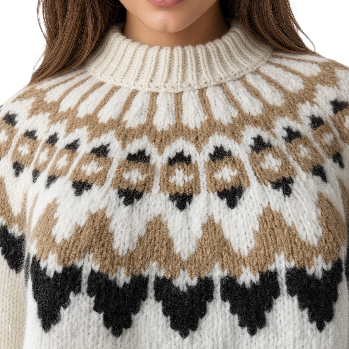 Close-up of a woman wearing a chunky knit sweater with a cream, tan, and black Fair Isle pattern.