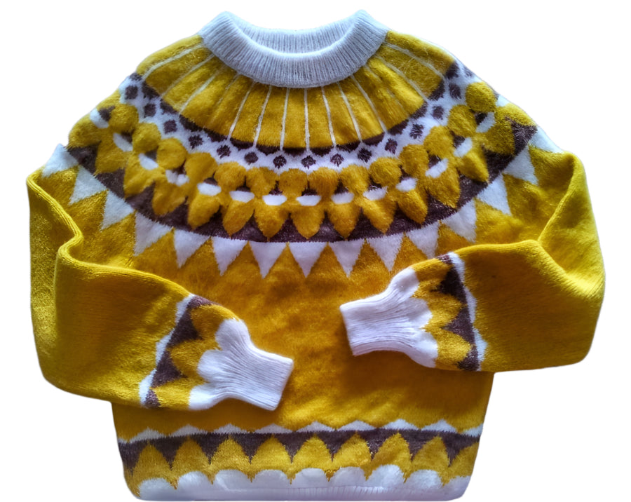 Yellow knitted sweater with a pattern on a white surface